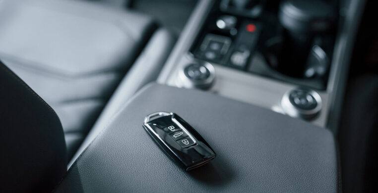 Illuminated by daylight that comes from the window. Close up view of interior of brand new modern luxury automobile.
